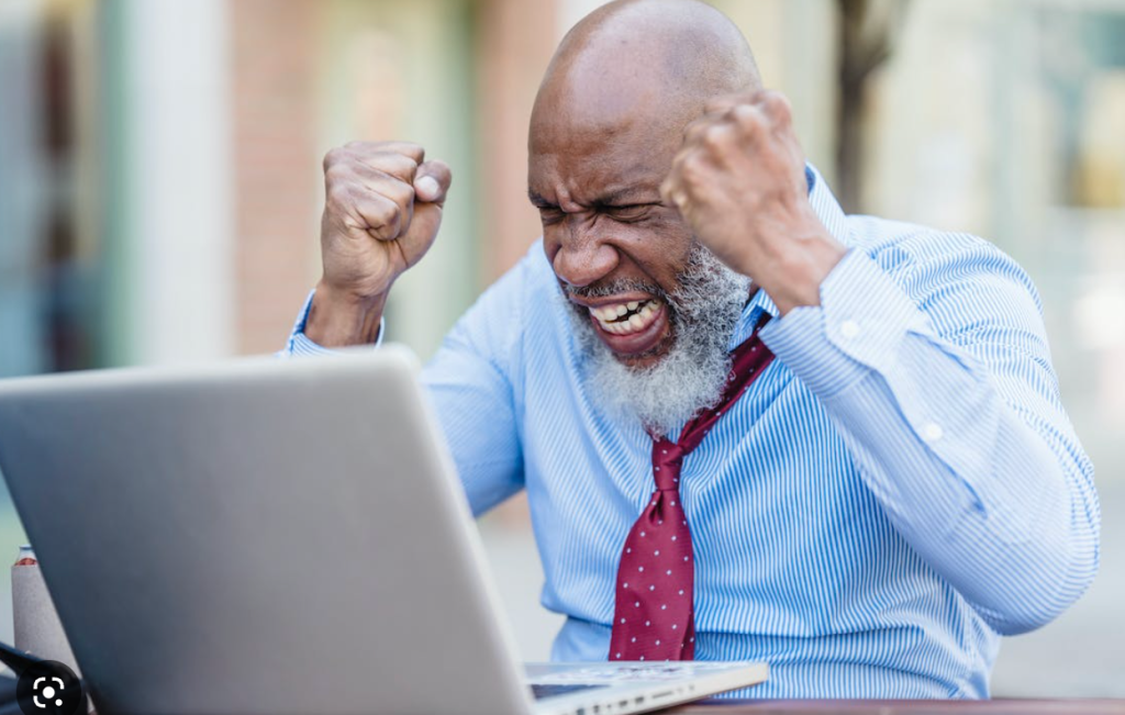 Image of a frustrated man encountering a broken link. User experiences are impacted by broken links.